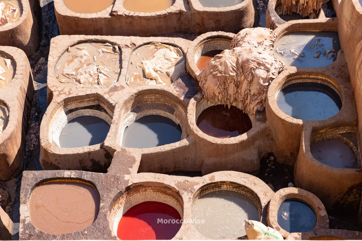 Leather workers and traditional dyeing vats in the Fes medina