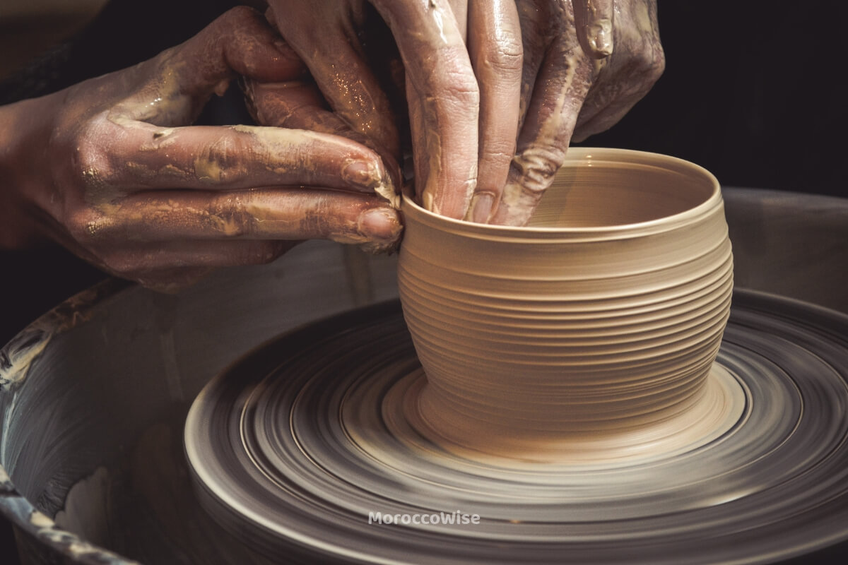 A Fes artisan shaping ceramics and traditional handicrafts